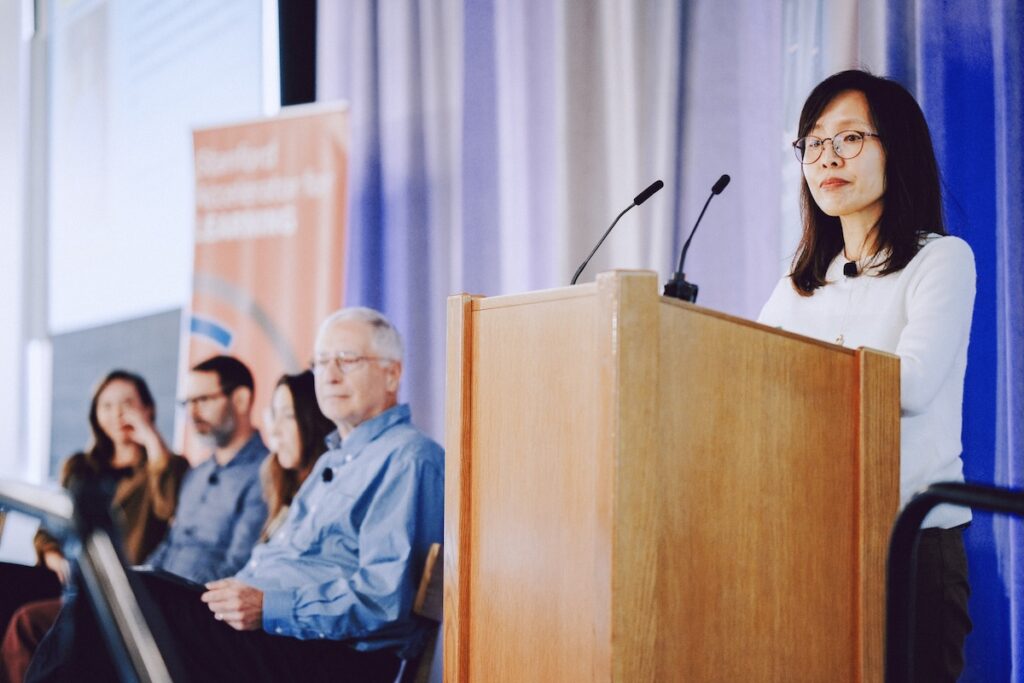 Pilyoung Kim speaks onstage.