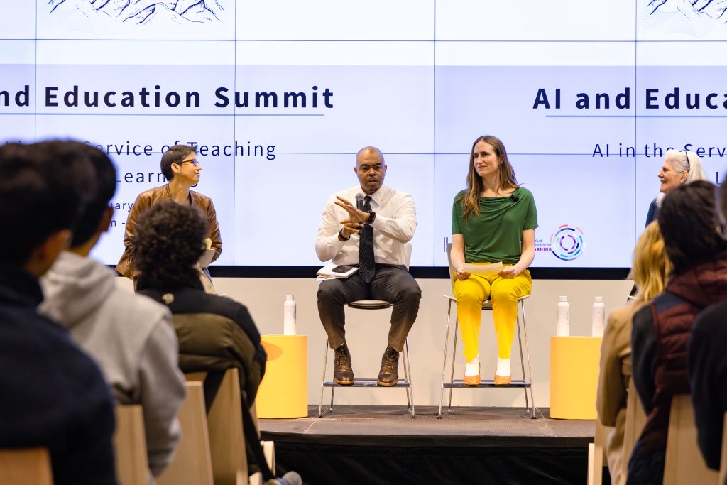 Sarah Levine, Bryan Brown, and Emma Brunskill on stage at the AI plus Education conference