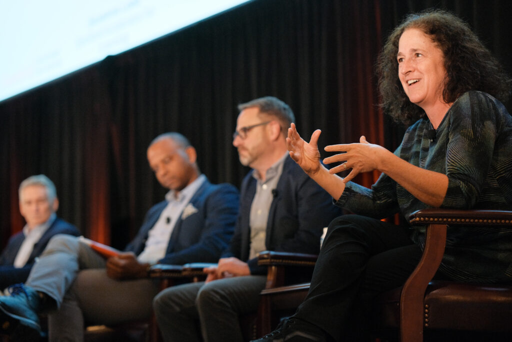 Professor Susanna Loeb gestures during a panel at the Accelerate EdTech Impact summit.