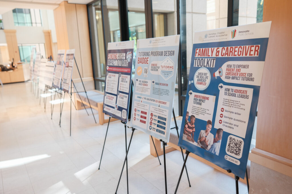 A row of posters providing information about high-impact tutoring.