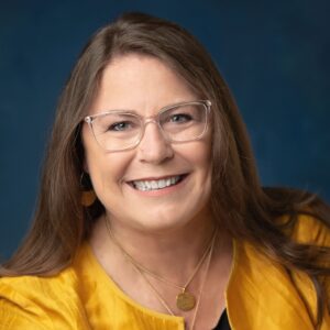 Headshot of Kelly May-Vollmar