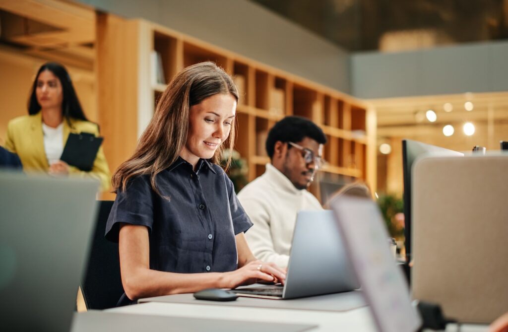An office worker uses her laptop.