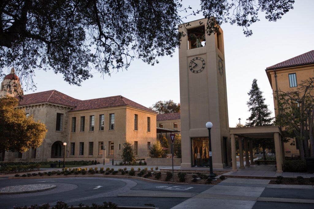 The last light of the day illuminates the Stanford Graduate School of Education's ANKO building and courtyard.